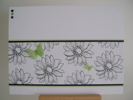 black and white flowers with two green vellum butterflies
