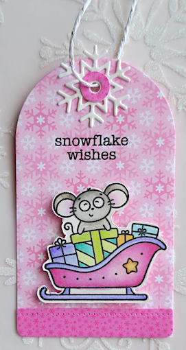christmas tag with mouse in sleigh of presents on a pink snowflake bCKGROUND
